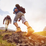 Trekking concept two tourists walking mountains